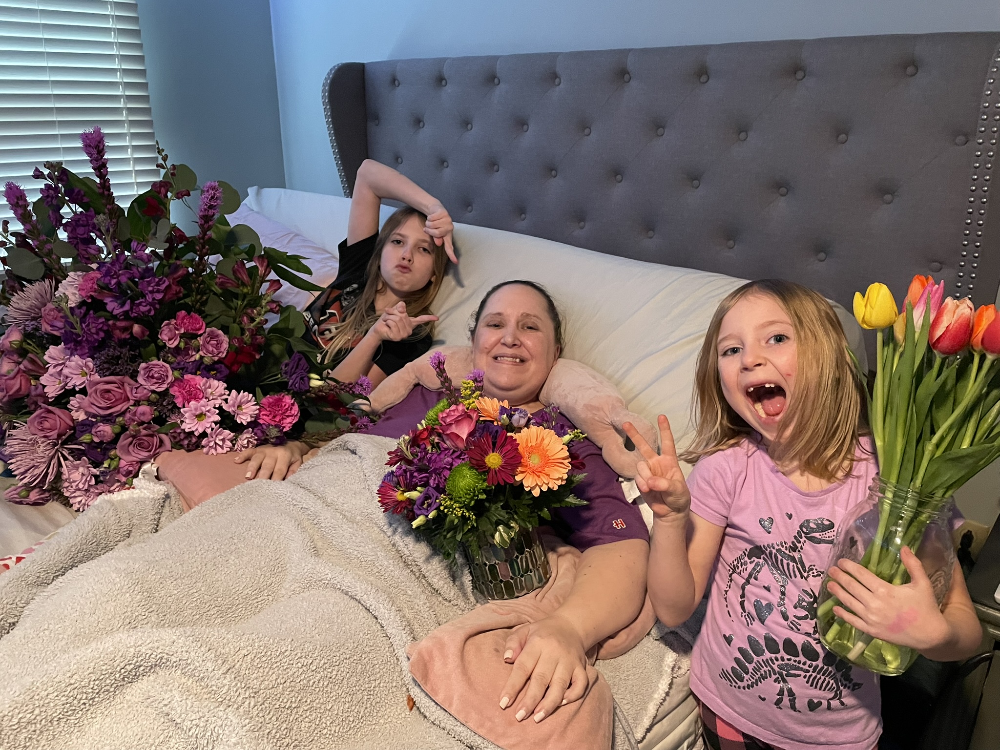 Jen and her nieces with flowers